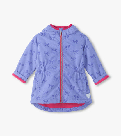 Front view of lilac hooded field jacket with reveal bow print, pink zipper trim, and pink lining