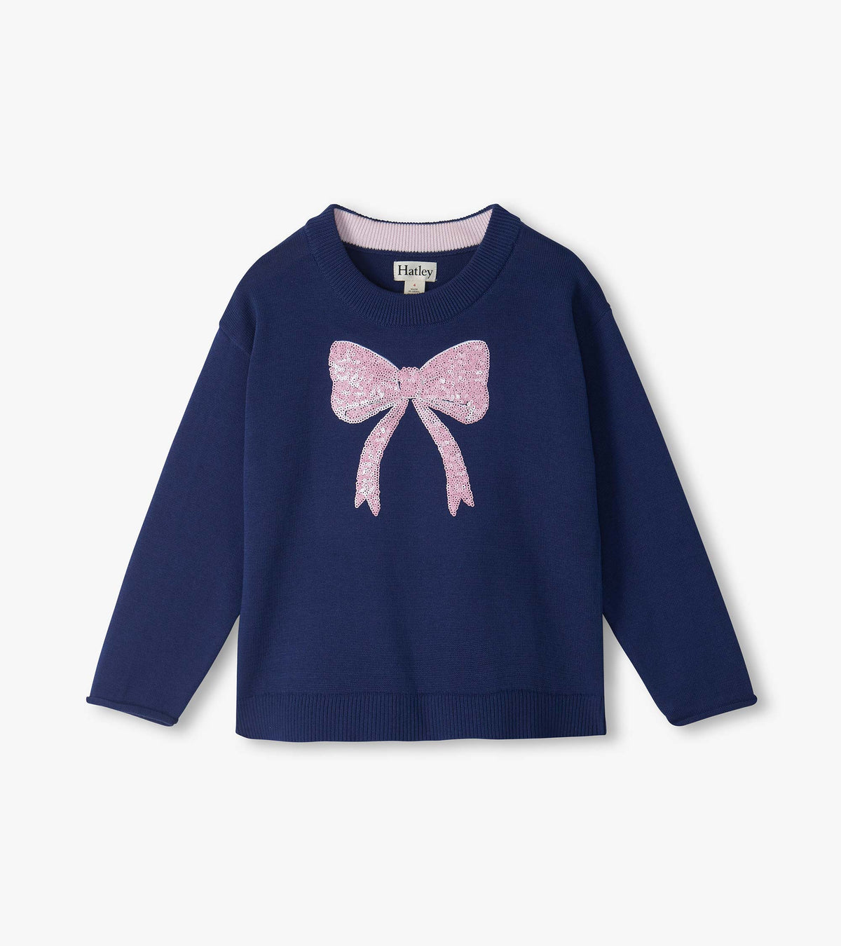 Front view of navy crew neck sweater with long sleeves and a pink sequin bow on the chest
