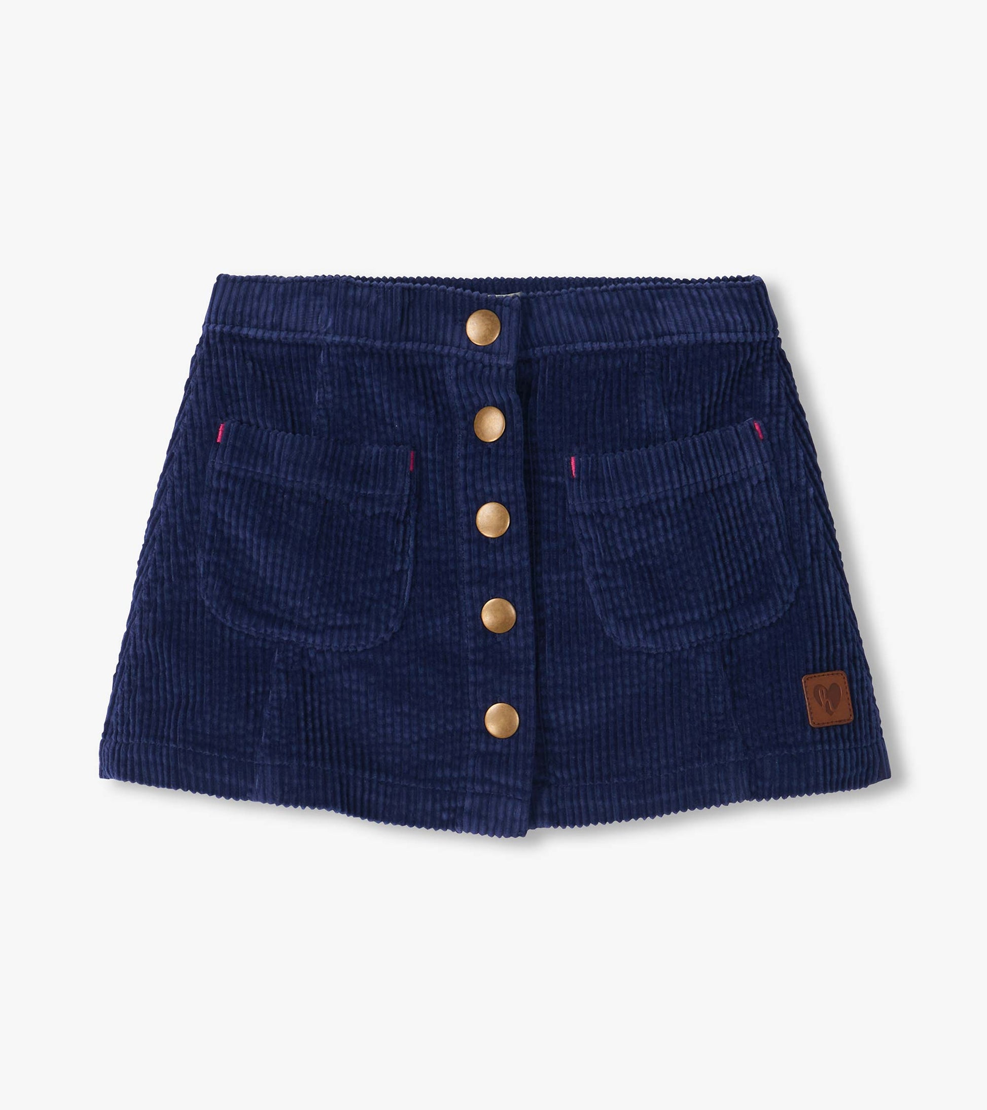 Patriot blue A-line skirt with front snap buttons, two front pockets, and a small logo patch near the hem