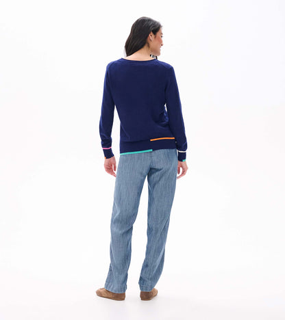 Back view of patriot blue crew neck sweater with multicolor trim at cuffs and hem