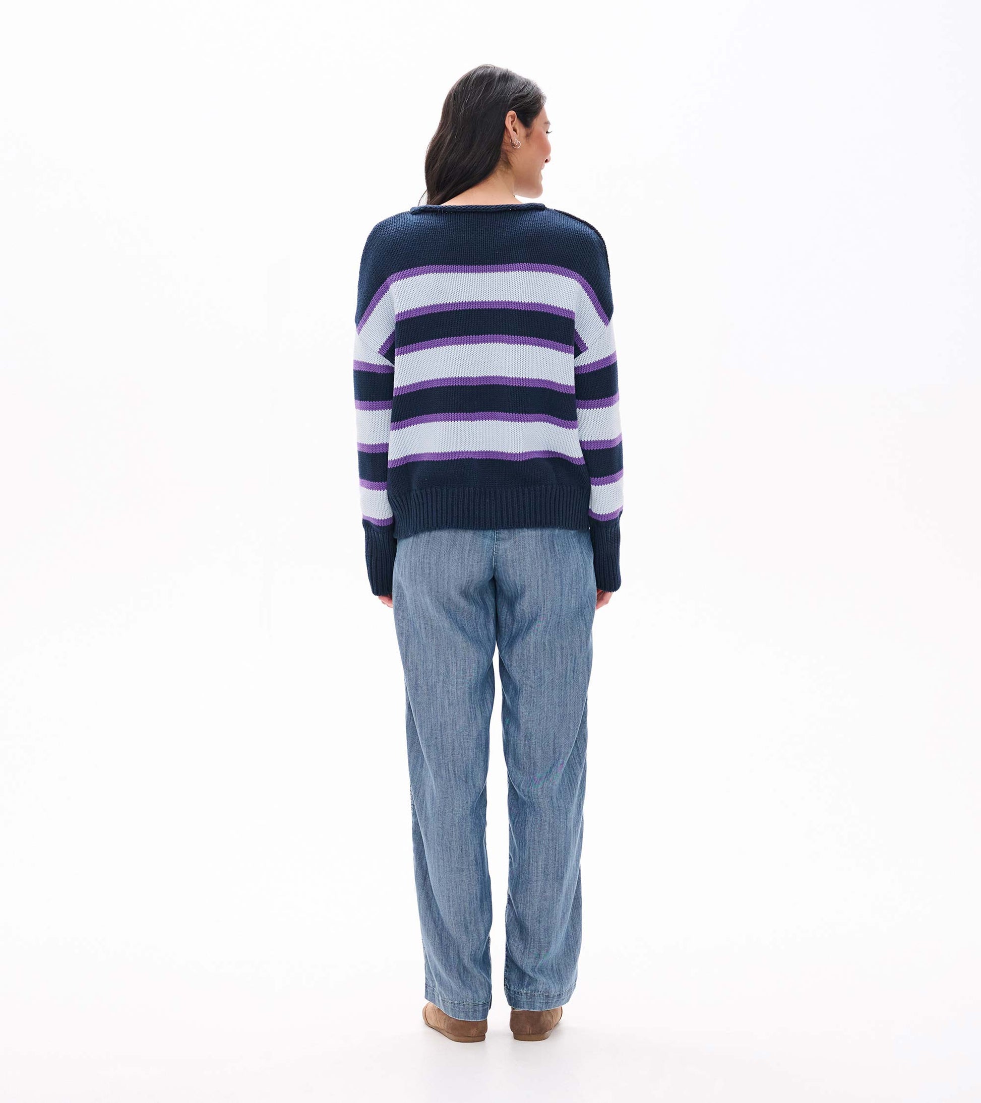 Back view of rolled collar sweater with navy, white, and purple horizontal stripes