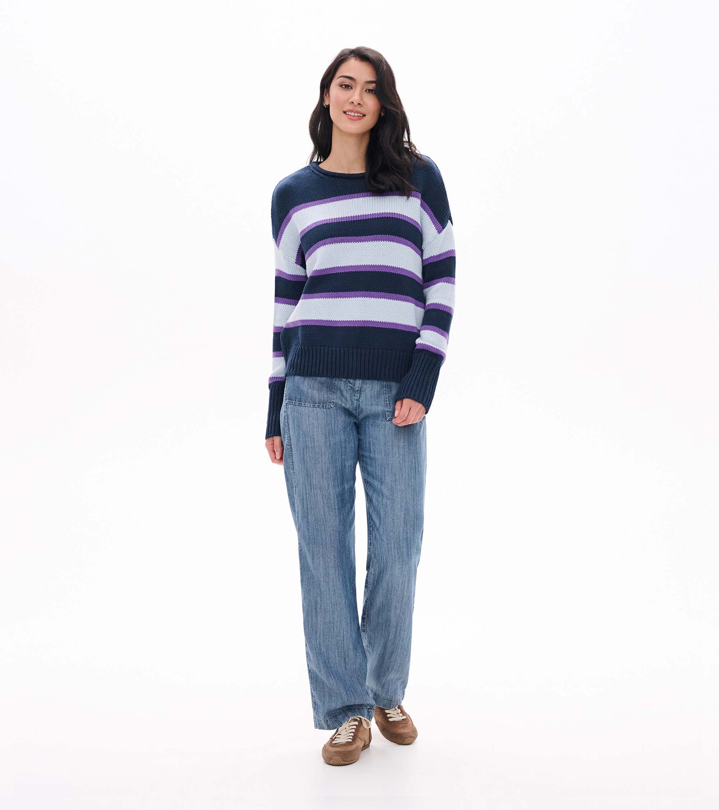 Front view of rolled collar sweater with navy, white, and purple stripes and ribbed hem and cuffs