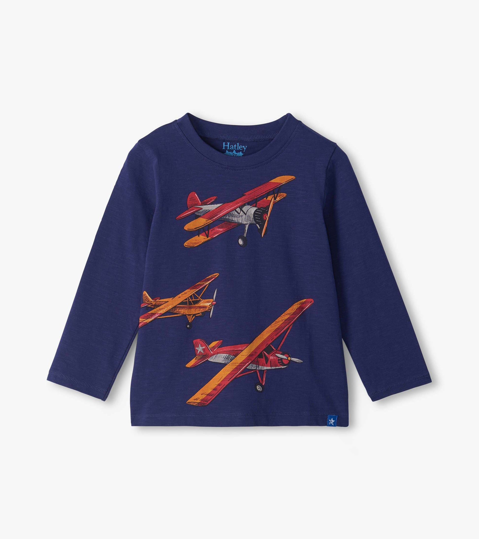 Front view of a navy long sleeve crew neck tee with red, orange, and gray vintage airplane print