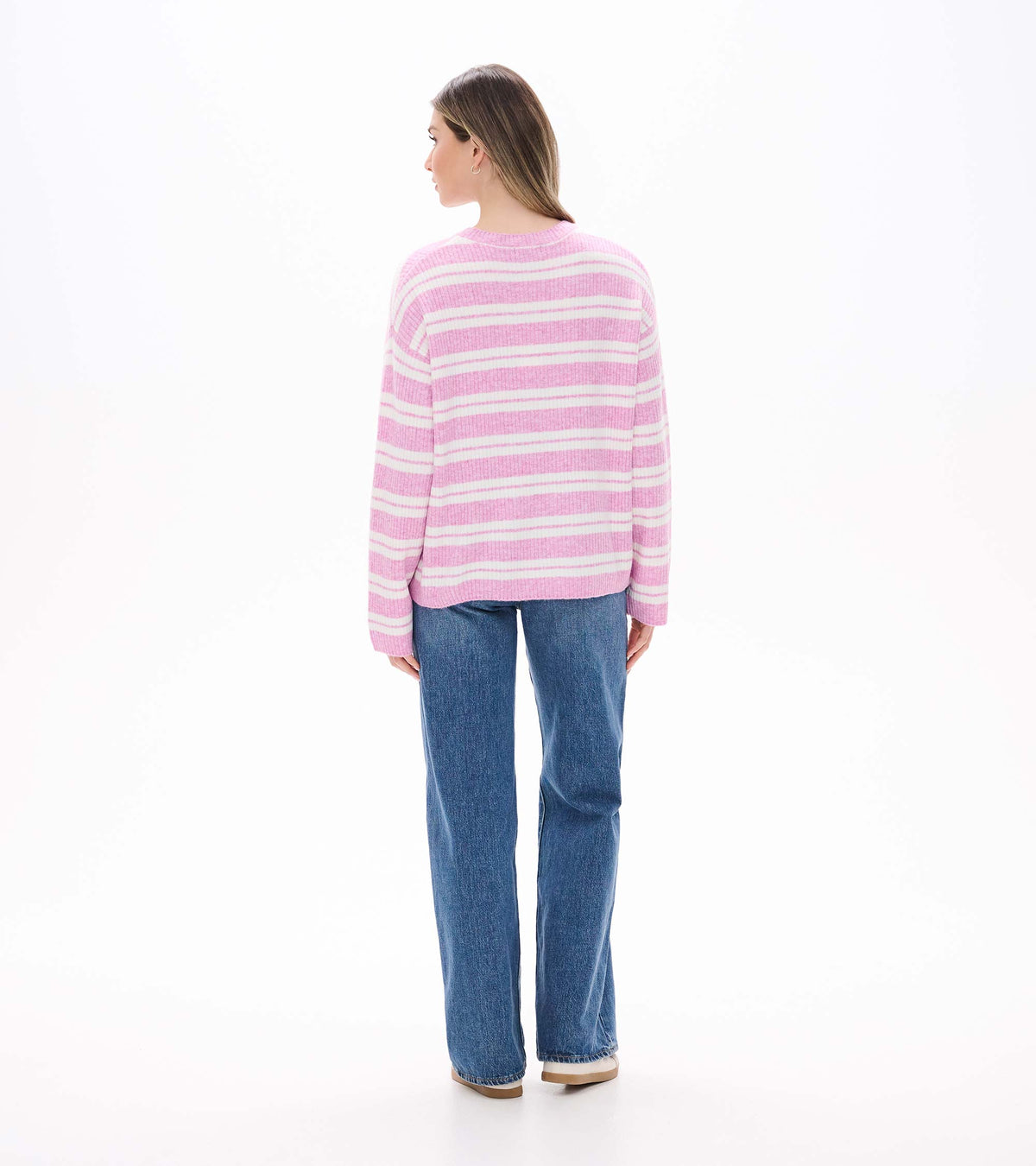 Back view of pink and cream striped sweater with long sleeves and relaxed shape
