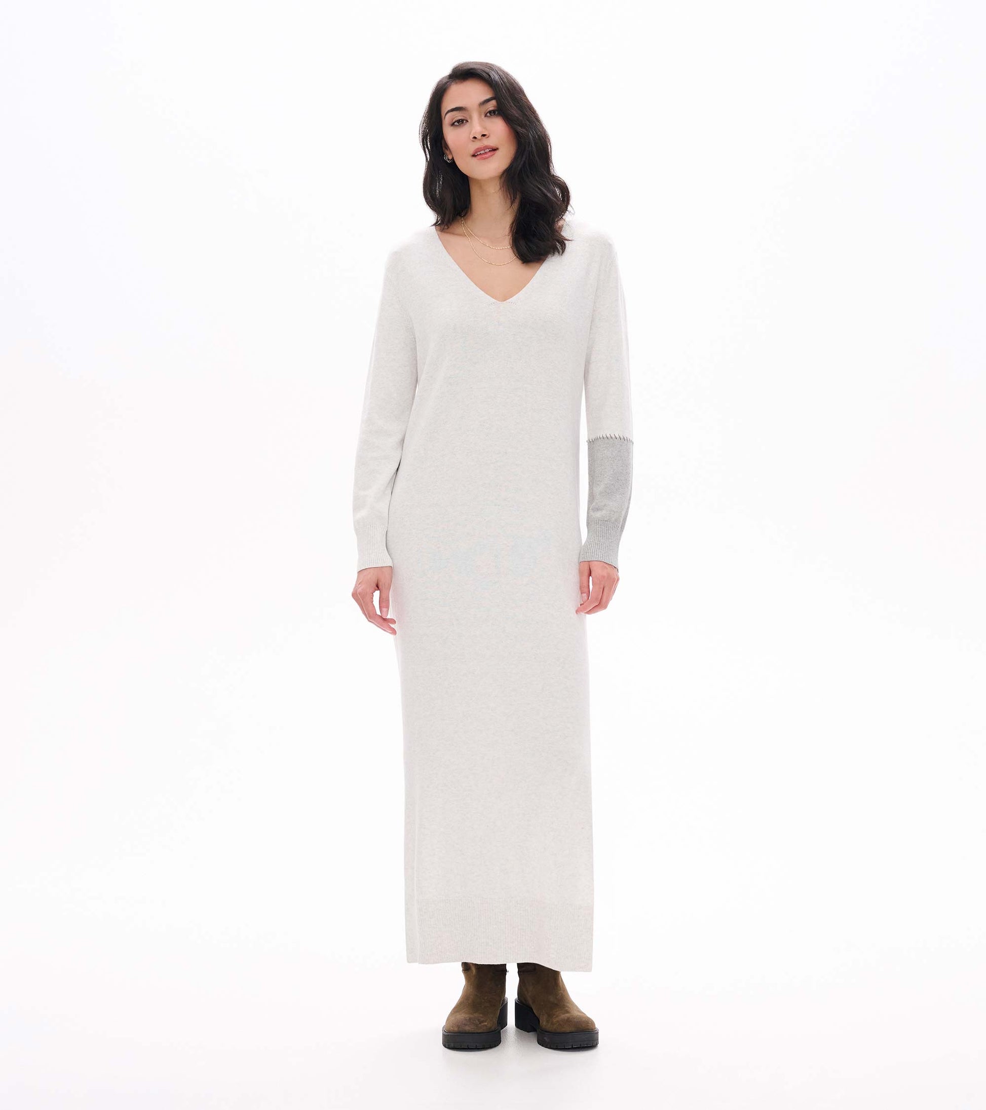 Front view of pale grey melange maxi sweater dress with V-neck and contrast right sleeve panel
