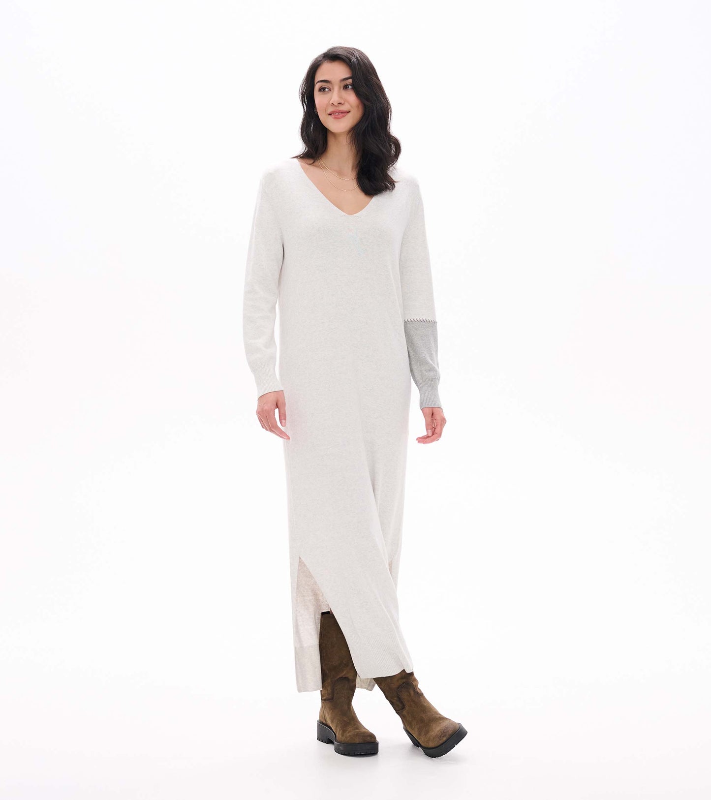 Angled front view of pale grey melange maxi sweater dress with V-neck and side slit