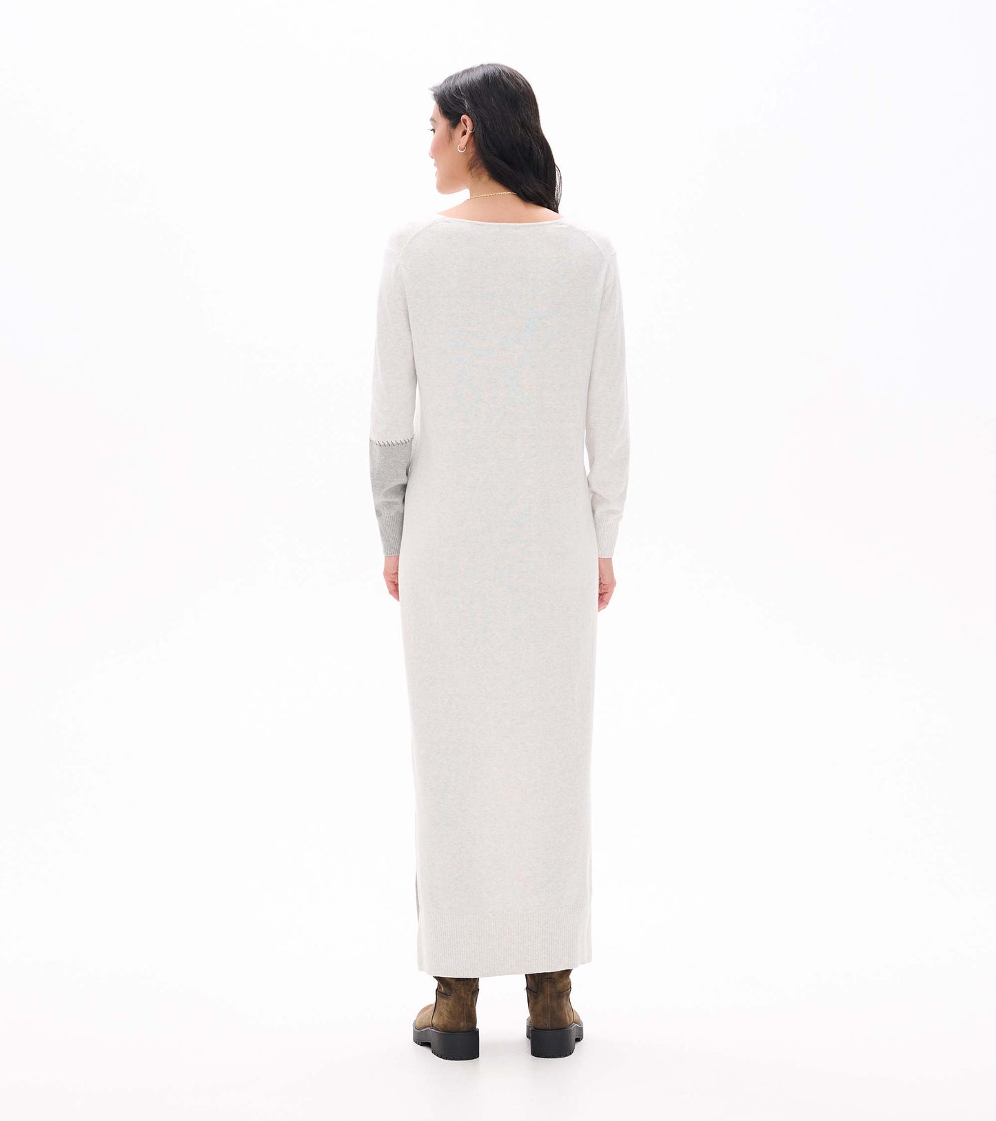 Back view of pale grey melange maxi sweater dress with long sleeves and contrast right sleeve panel