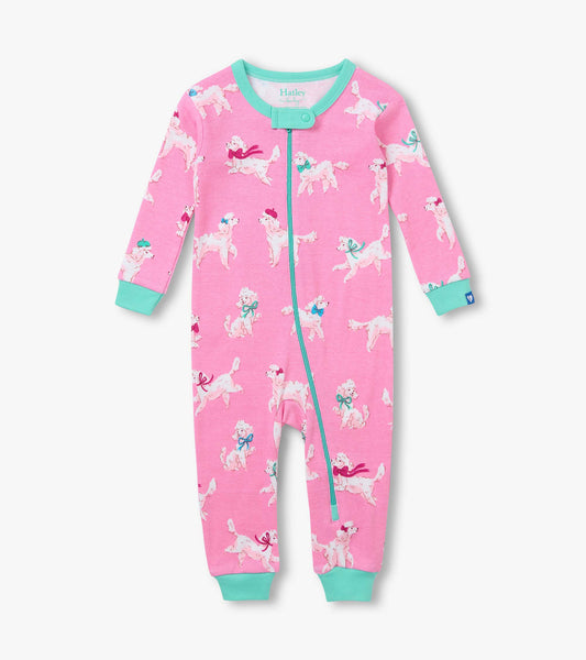 Front view of pink infant coverall with white poodle print, aqua trim, long sleeves, and zip front