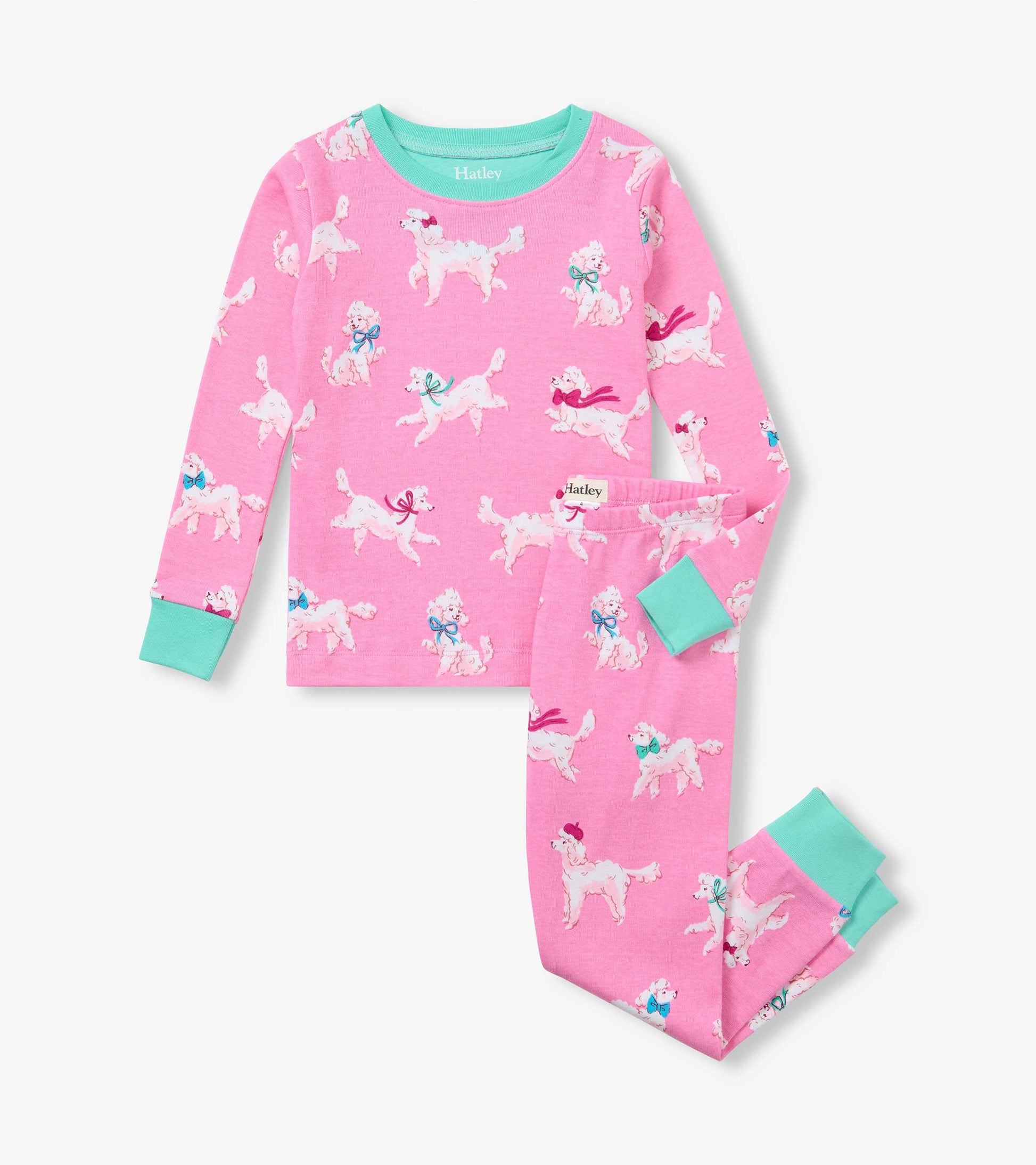 Pink kids pajama set with white poodle print and aqua trim on the collar, cuffs, and ankle hems