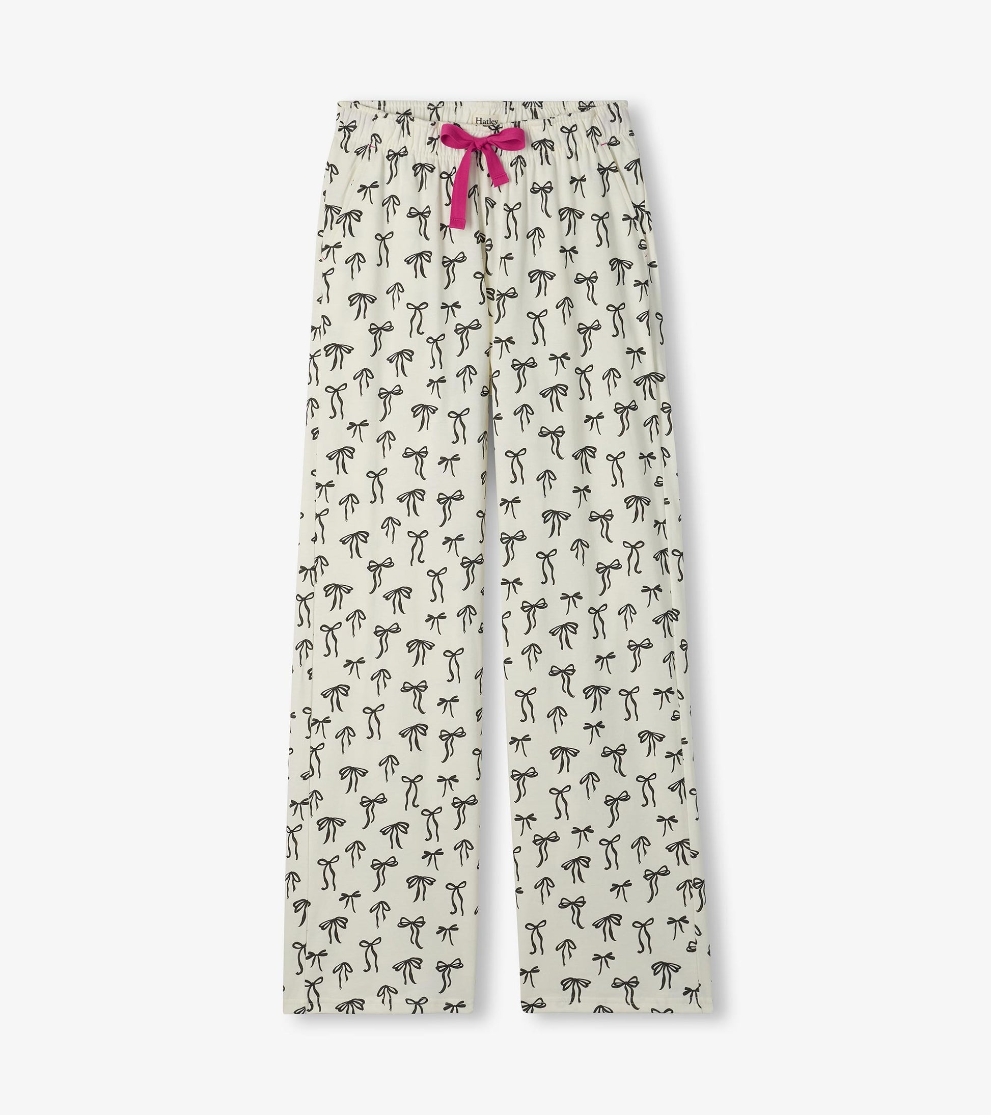 Cream pajama pants with black bow print, straight legs, and a pink drawstring waist