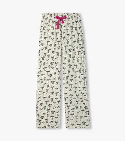Cream pajama pants with black bow print, straight legs, and a pink drawstring waist