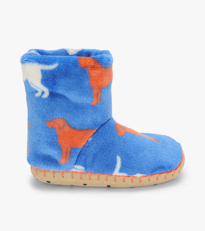 Side view of a blue fleece slipper boot with orange and white dog silhouette print and tan sole