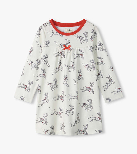 Girls white long sleeve nightdress with leaping reindeer print, red neckline, and small red bow