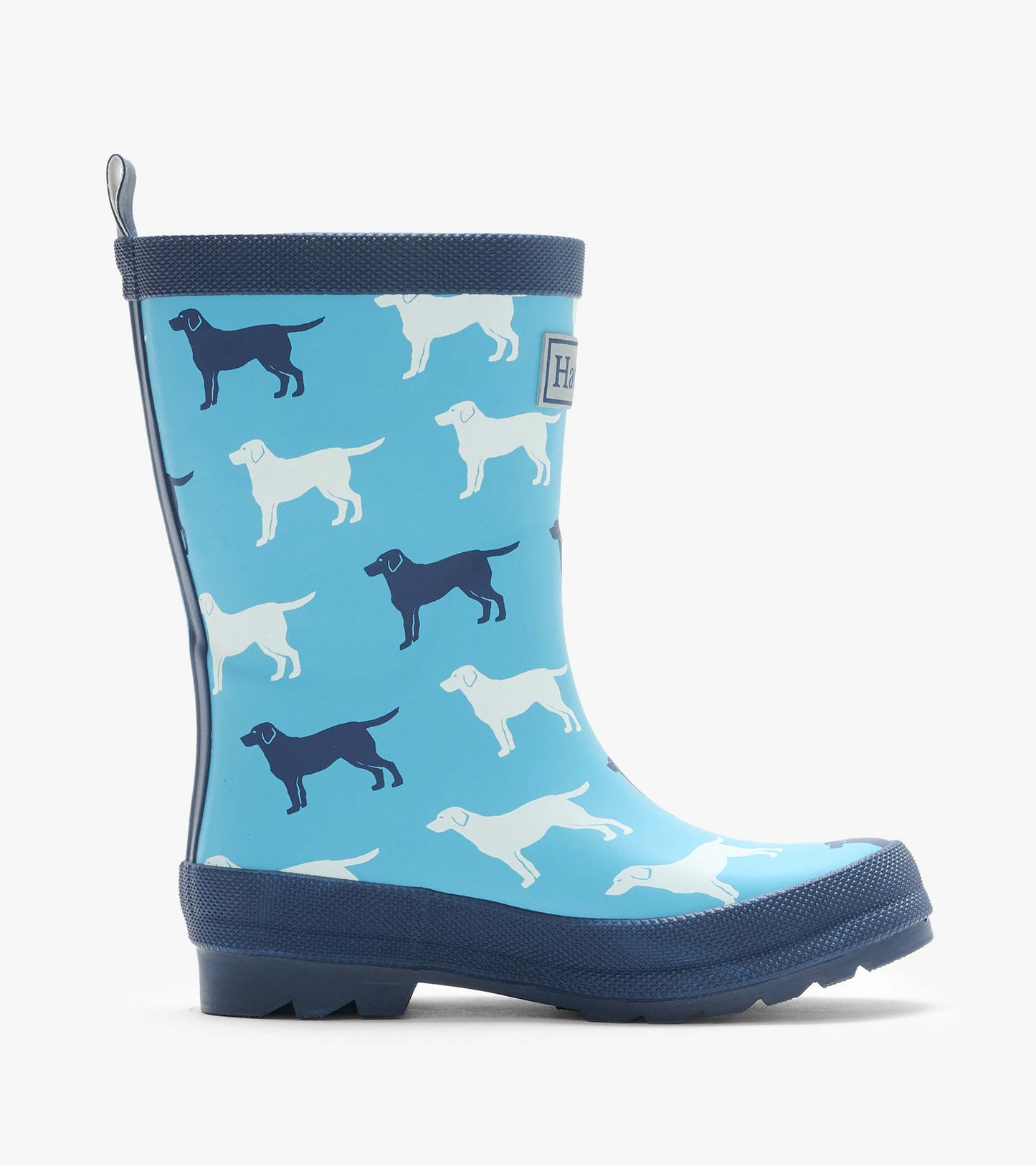 Single blue rain boot with white and navy dog silhouettes and navy trim, side view
