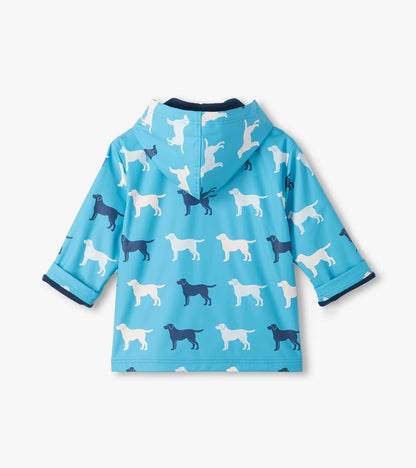 Back view of blue hooded rain coat with white and navy dog silhouette print