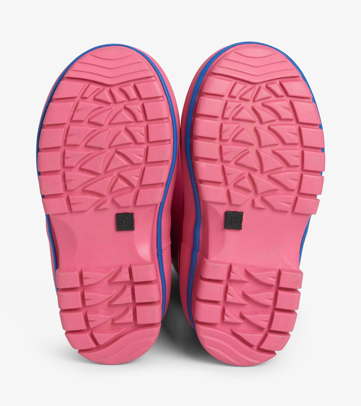 Bottom view of pink Boreal boots showing textured outsole tread pattern