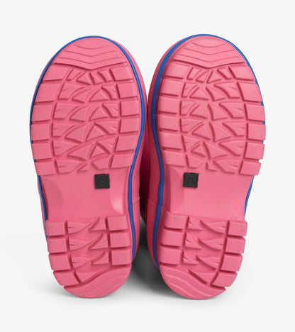 Bottom view of pink Boreal boots showing textured outsole tread pattern