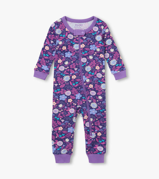 Front view of infant coverall in purple floral print with front zipper and lavender cuffs