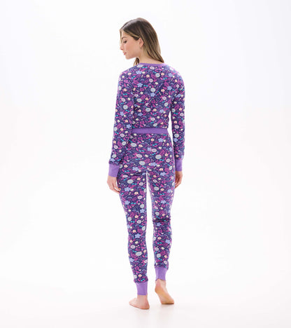 Back view of purple floral pajama set with long sleeves, fitted pants, and solid purple cuffs