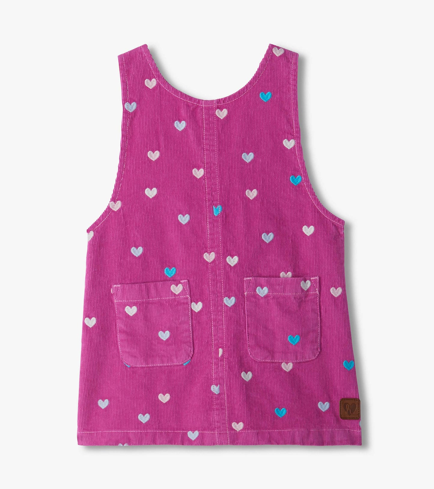 Front view of pink pinafore dress with embroidered hearts and two front patch pockets