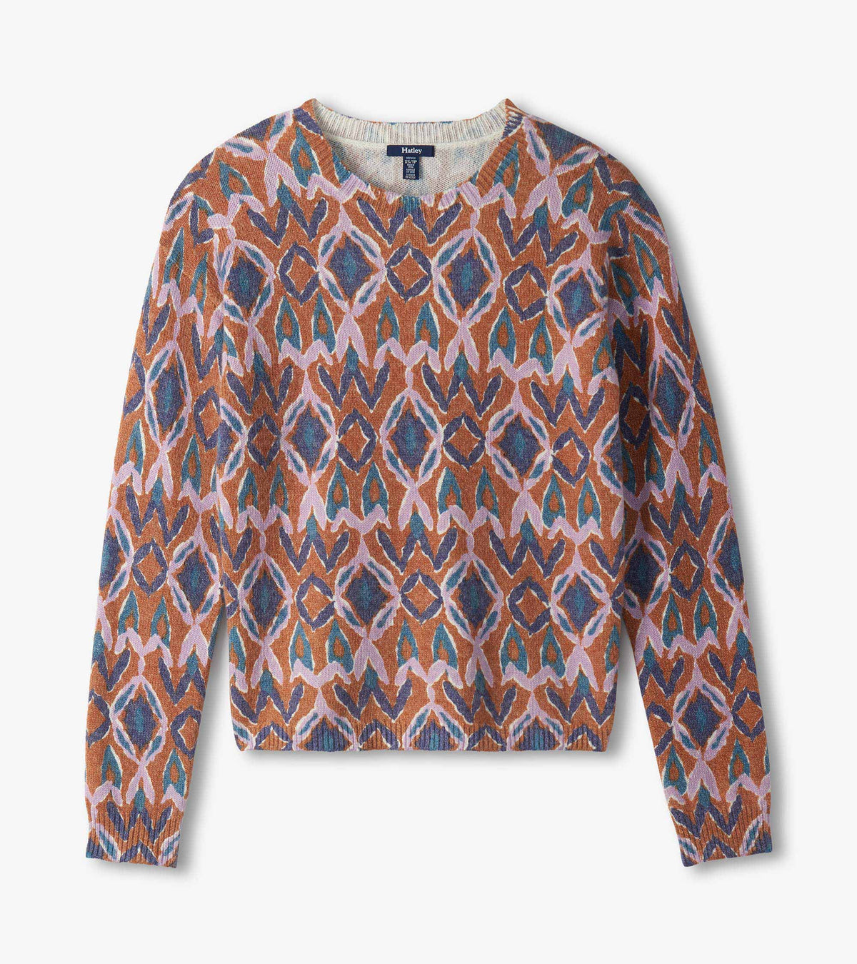 Flat lay of patterned crewneck sweater in pink, blue and rust ikat print
