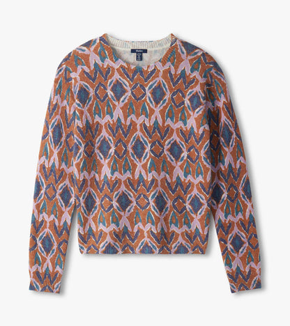 Flat lay of patterned crewneck sweater in pink, blue and rust ikat print