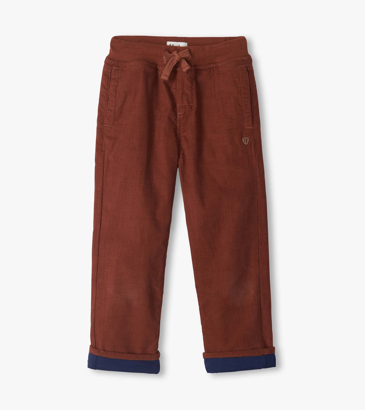 Front view of tortoise brown pull-on pants with drawstring waist, front pockets, and turned-up navy cuffs
