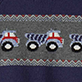 View Baby & Toddler Boys Trucks Shawl Collar Cardigan Blue knit swatch with red, white, and blue trucks in a horizontal row and zigzag stripe accents
