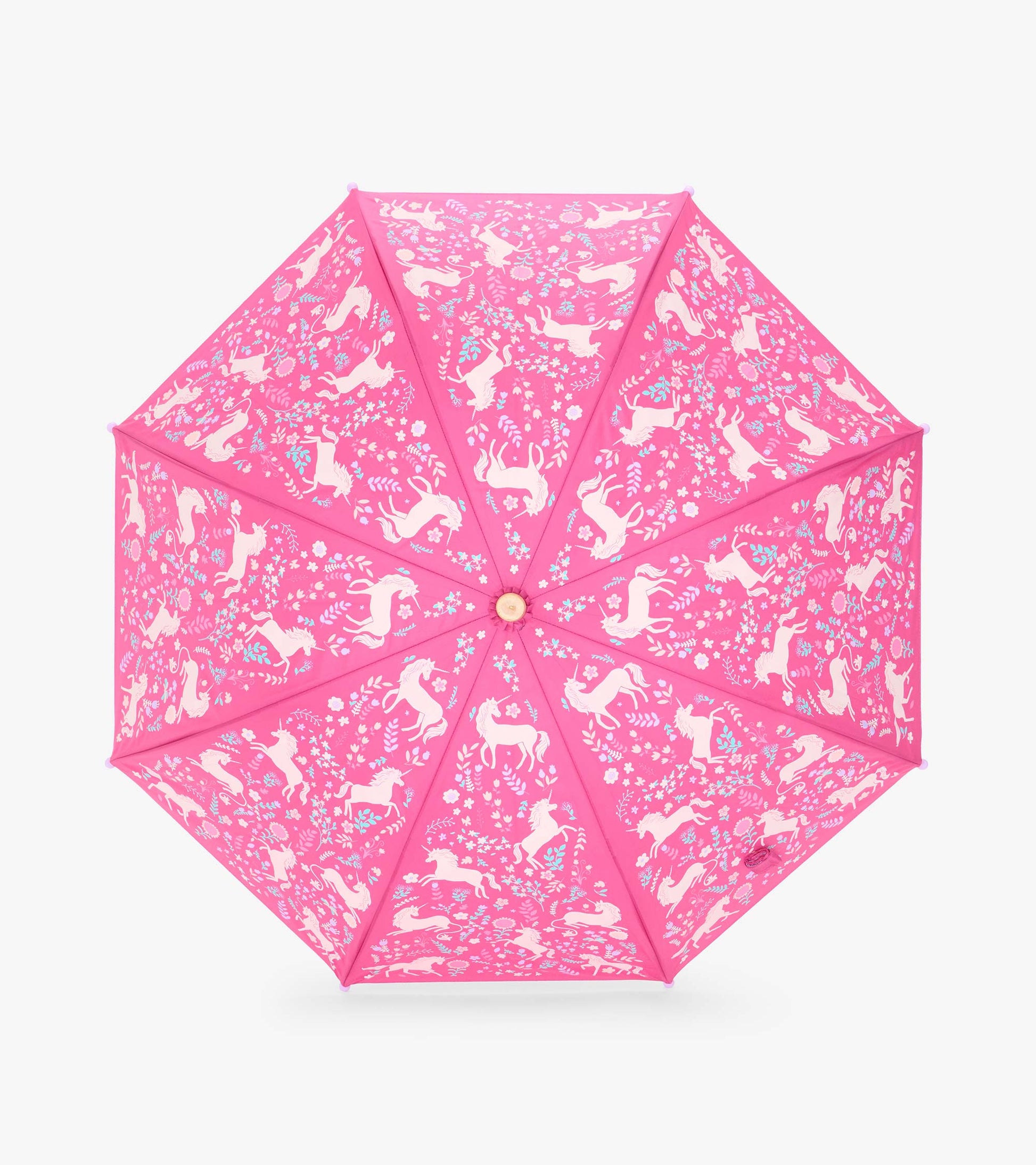 Top view of open pink umbrella with white unicorns and scattered floral pattern