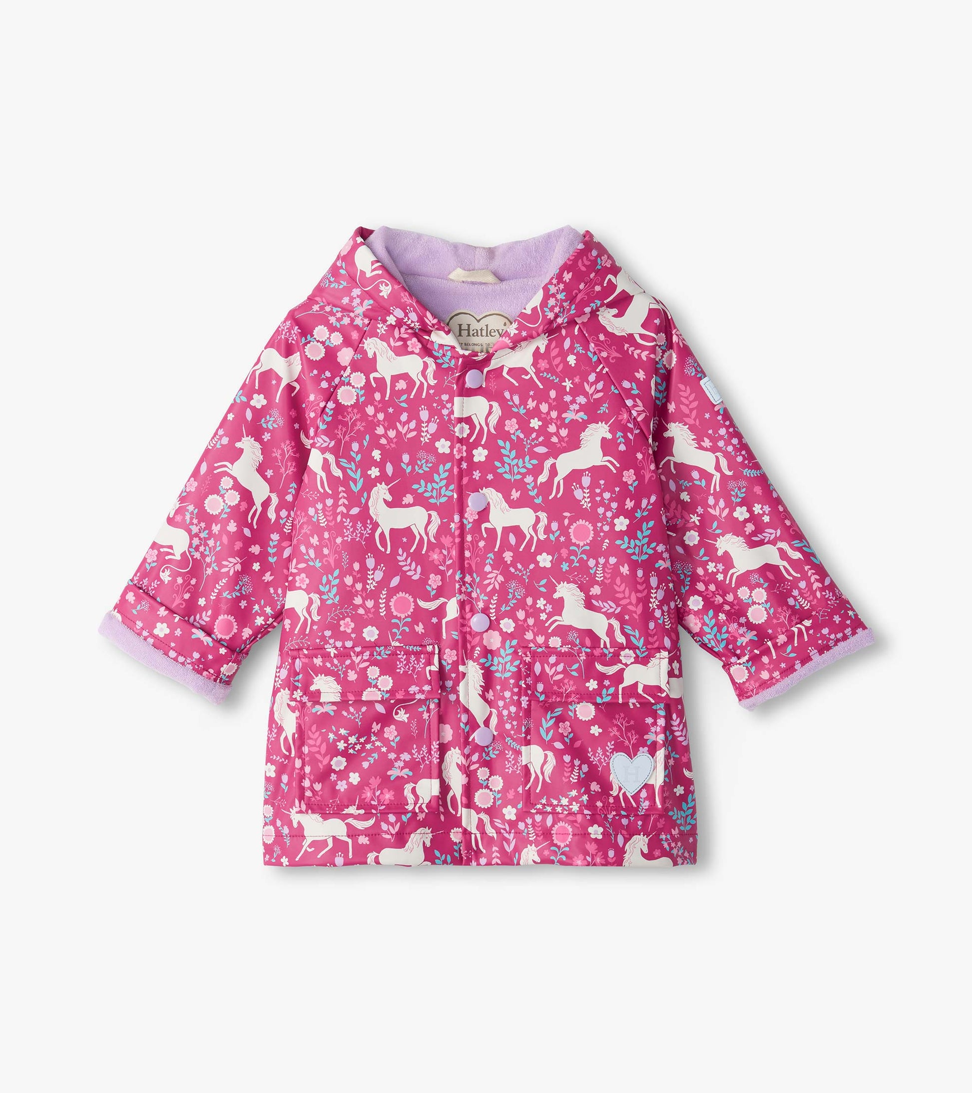 Front view of pink hooded snap rain coat with white unicorn and floral print, flap pockets, and lavender lining