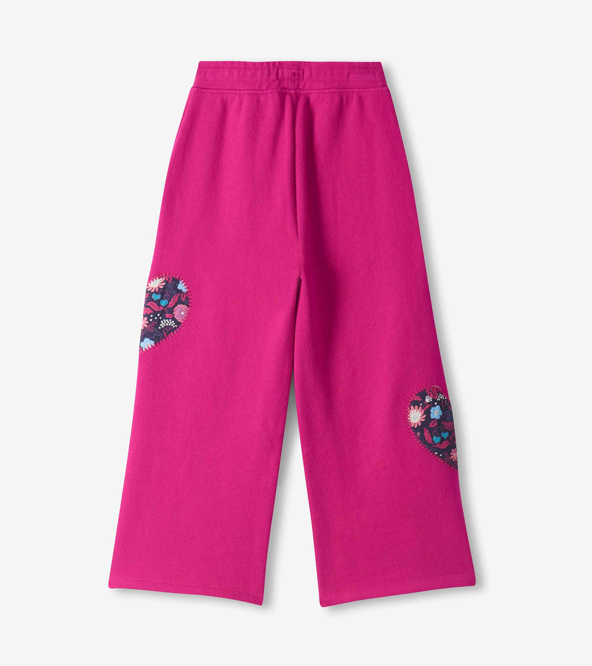 Back view of girls berry wide leg track pants with floral heart patches on both legs