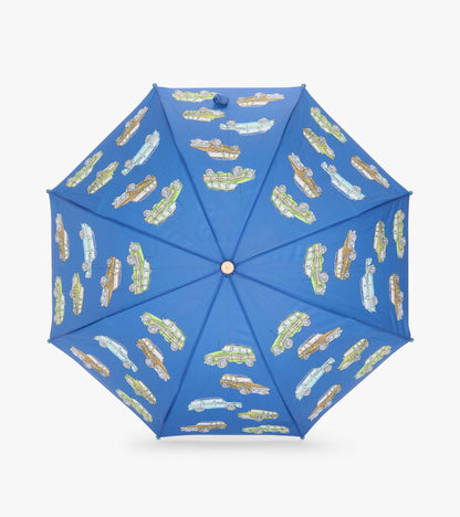 Top view of blue umbrella canopy with green, brown, and light blue vintage truck print