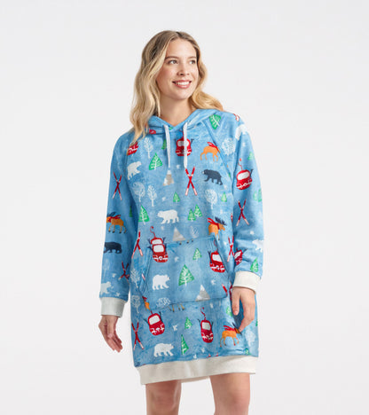 Light blue oversized fleece hoodie featuring a colorful winter-themed pattern with animals and trees.