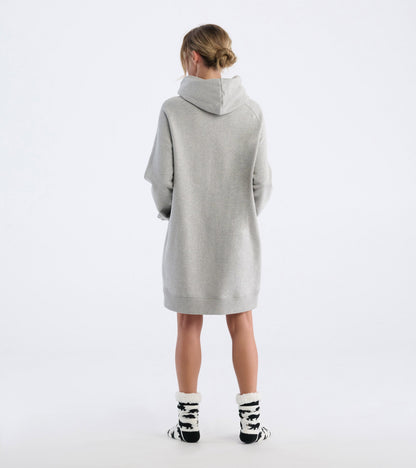 Oversized black hoodie with a cozy fit, featuring a hood and long sleeves, styled with black and white patterned socks.