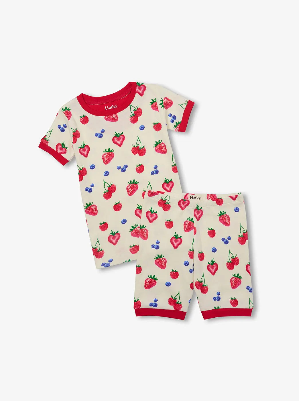Shop kids' sleepwear. Showing cream short-sleeve pajama set with red trim and berry print.
