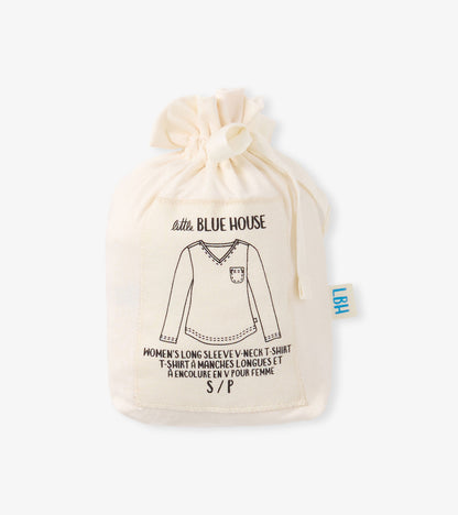 Cream long sleeve t-shirt with a v-neck and pocket design, displayed in a drawstring bag.