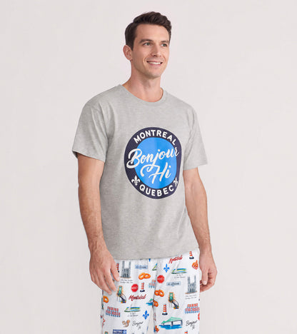 Man wearing a heather gray Bonjour Hi T-shirt with a blue Montreal Quebec graphic on the front