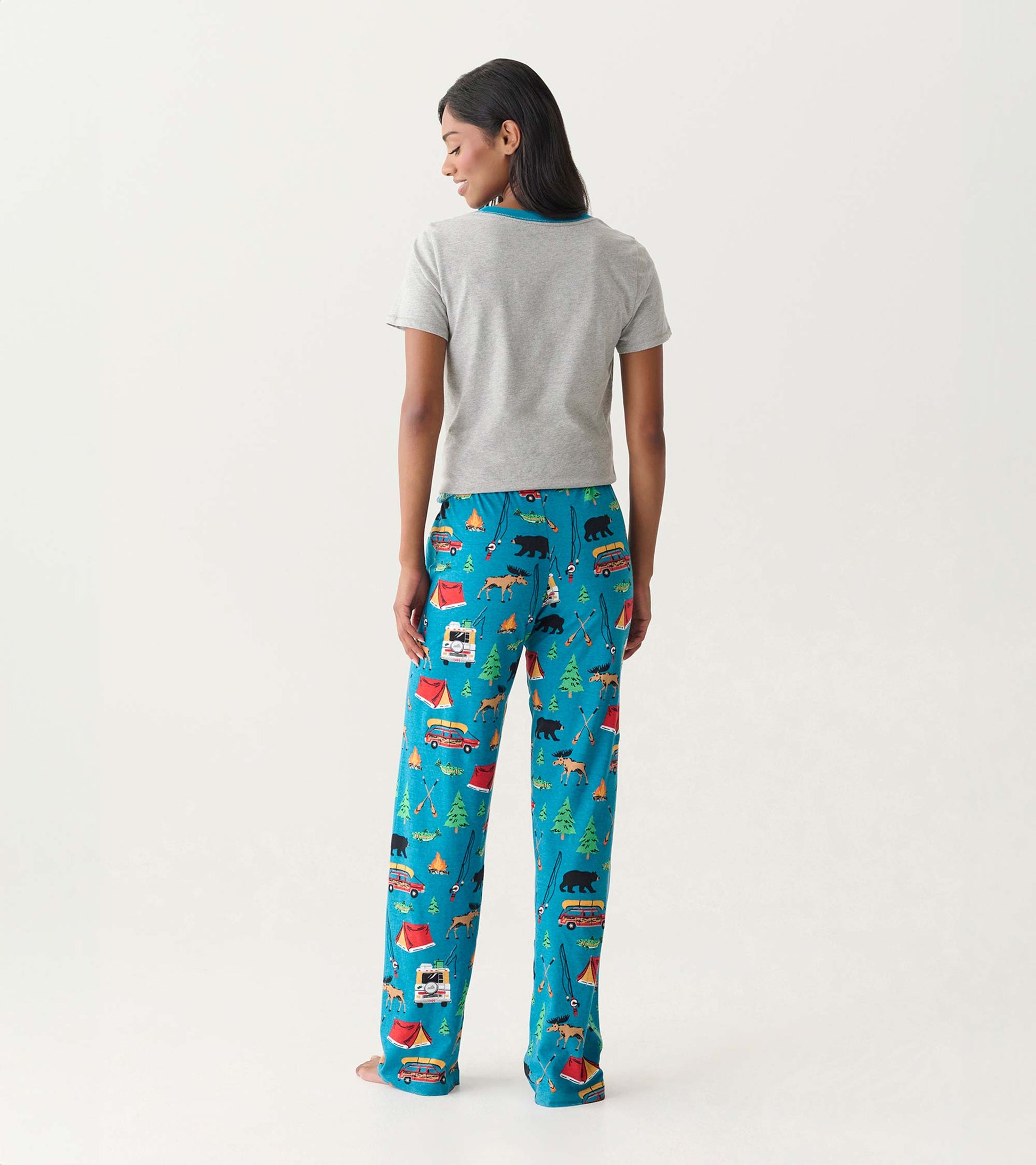Back view of gray cotton pajama top and bright blue camping-print pajama pants with wide legs