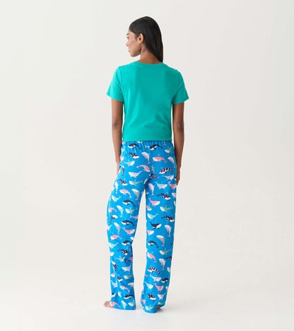Back view of blue cotton pajama pants with colorful whale print, worn with a teal T-shirt