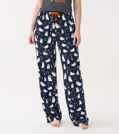 Front view of navy pajama pants with white ghost, star and crescent moon print and orange drawstring