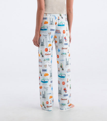 Back view of white Montreal pajama pants with colorful landmark print and elastic waistband