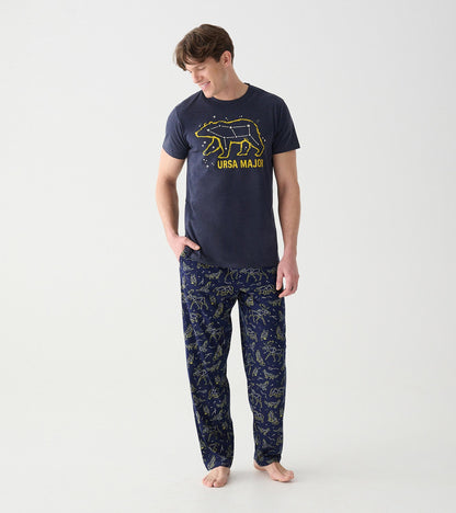 Model wearing navy animal constellation pajama pants with a matching Ursa Major graphic tee