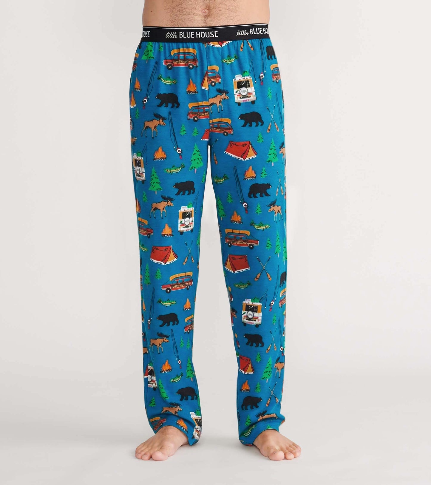 Front view of blue pajama pants with camping print and Little Blue House logo waistband