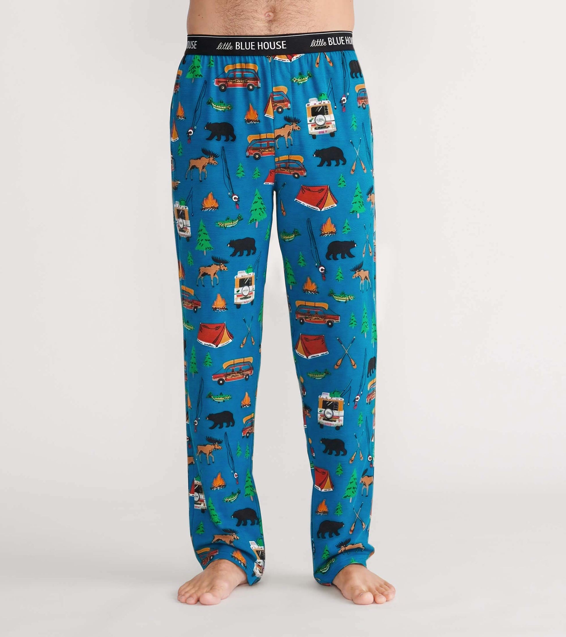 Front view of blue pajama pants with camping print and Little Blue House logo waistband