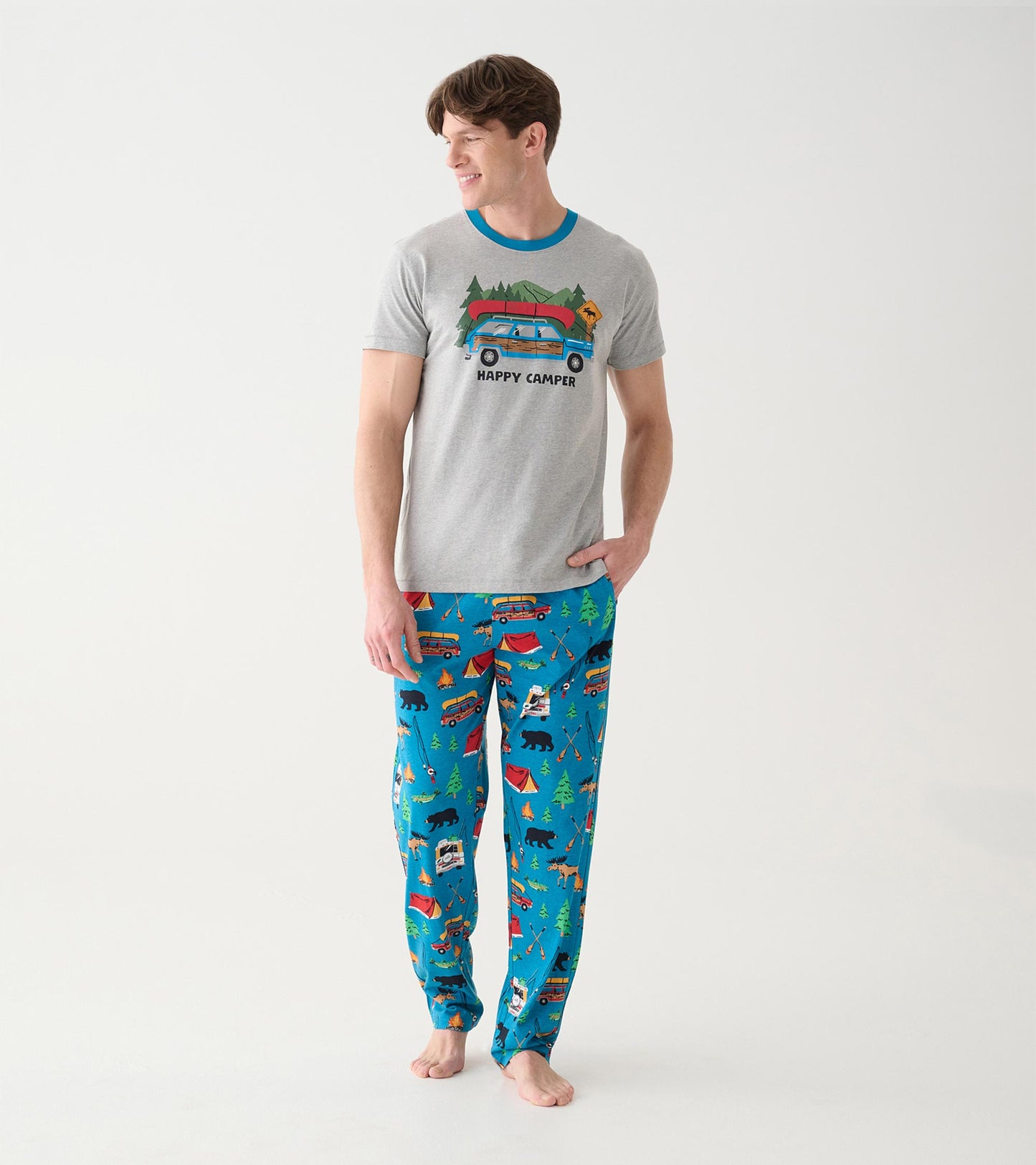 Model wearing blue camping print pajama pants with a gray Happy Camper graphic T-shirt