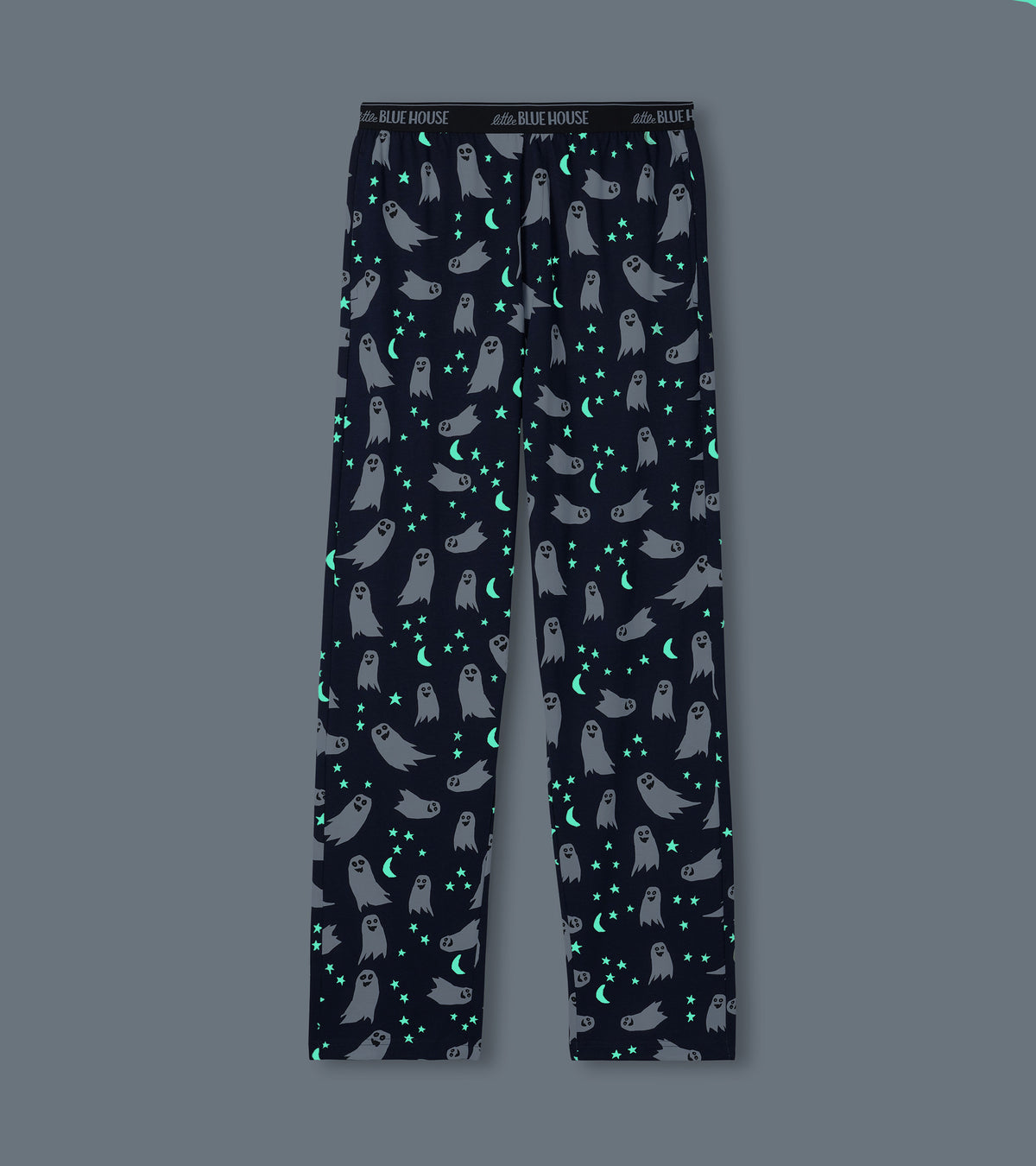 Navy pajama pants with white ghosts and glowing stars and crescent moons on dark background