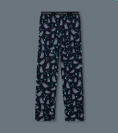Navy pajama pants with white ghosts and glowing stars and crescent moons on dark background