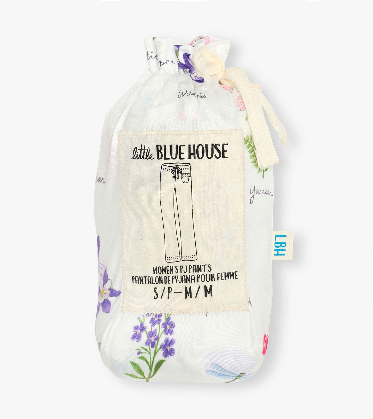 Folded white pajama pants with a colorful wildflower print and drawstring pouch packaging