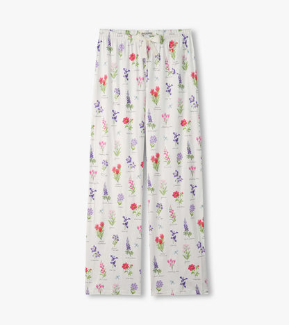 White pajama pants with colorful wildflower print and elastic drawstring waist, front view