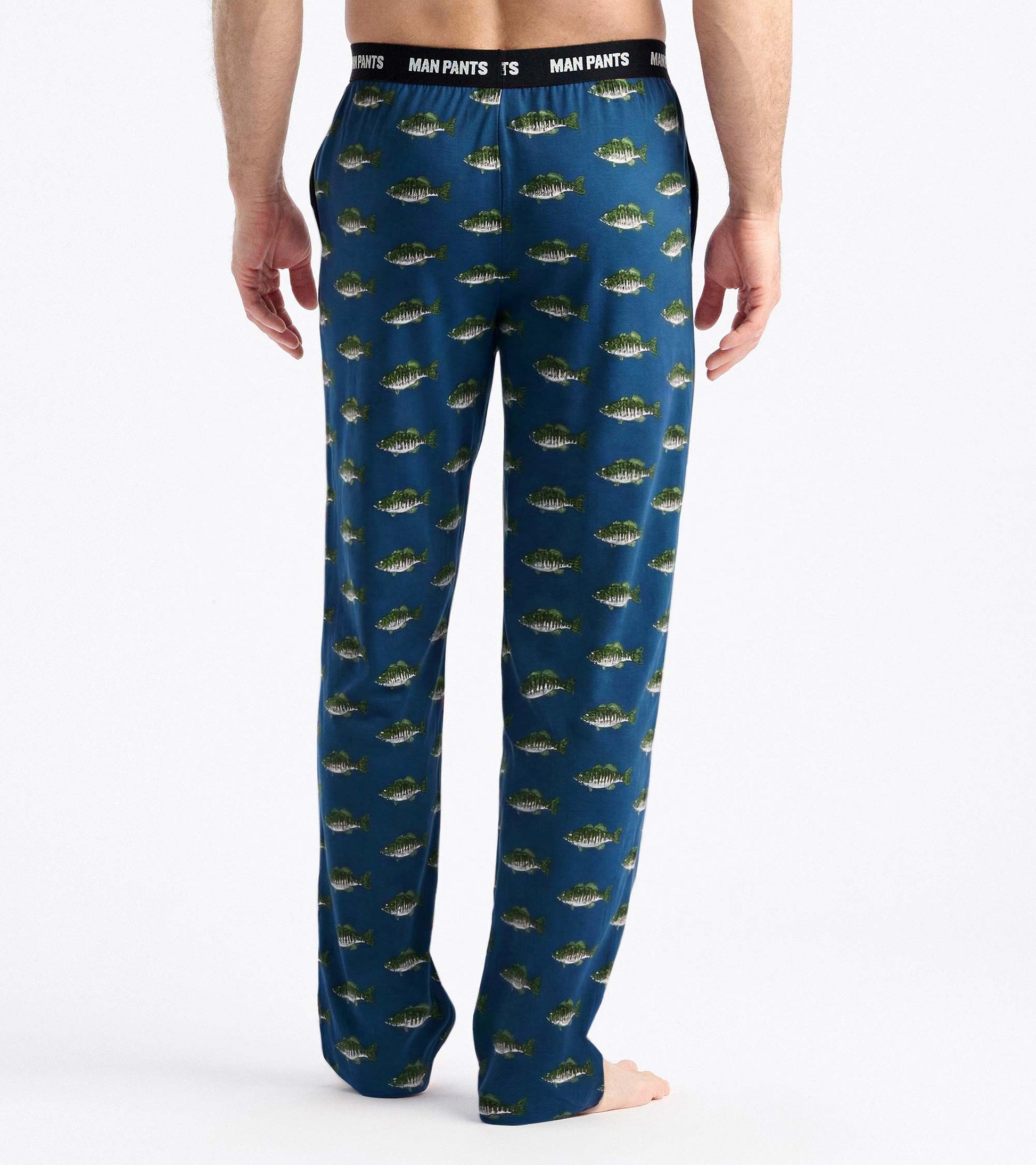 Back view of blue pajama pants with allover fish print and black elastic waistband